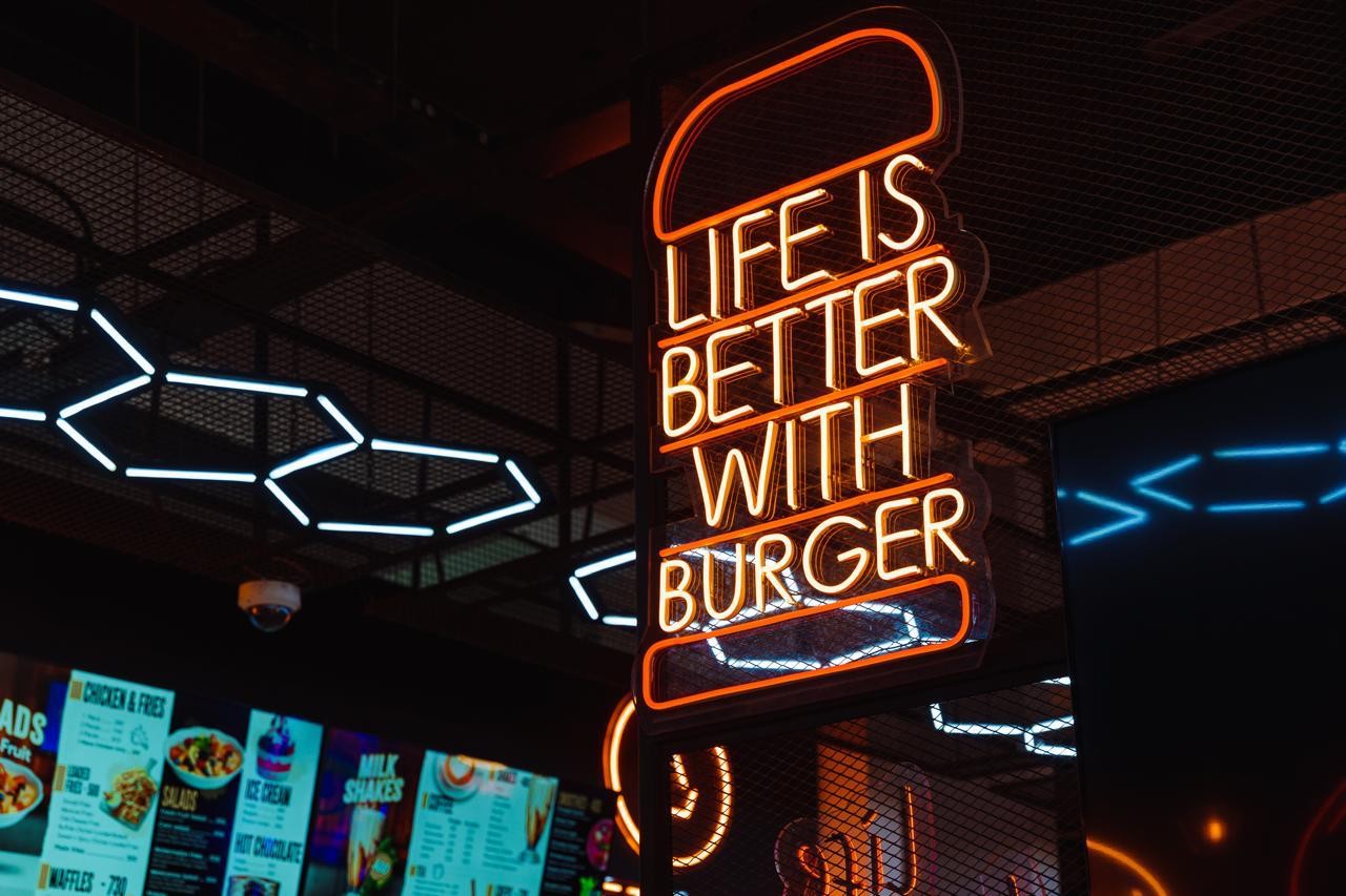 Kuku Kitchen — Vivid mural artwork and feature lighting